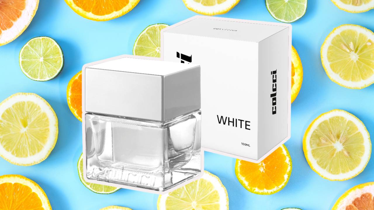 Perfume Colcci White Água de Cheiro sobre um fundo com frutas cítricas